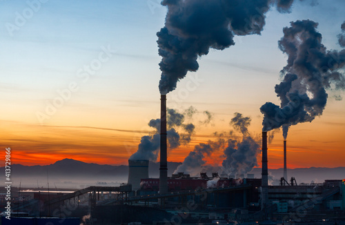 Winter sunset over a power plant