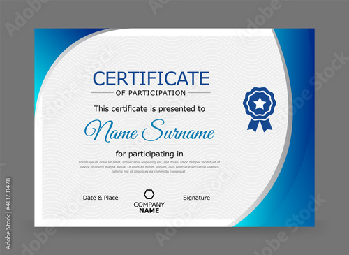 Certificate of participation design template in blue and grey colour with badge. photo
