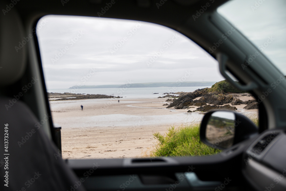 Scenic view of sea against cloudy sky seen through motor home window Scenic view of sea against cloudy sky seen through motor home window