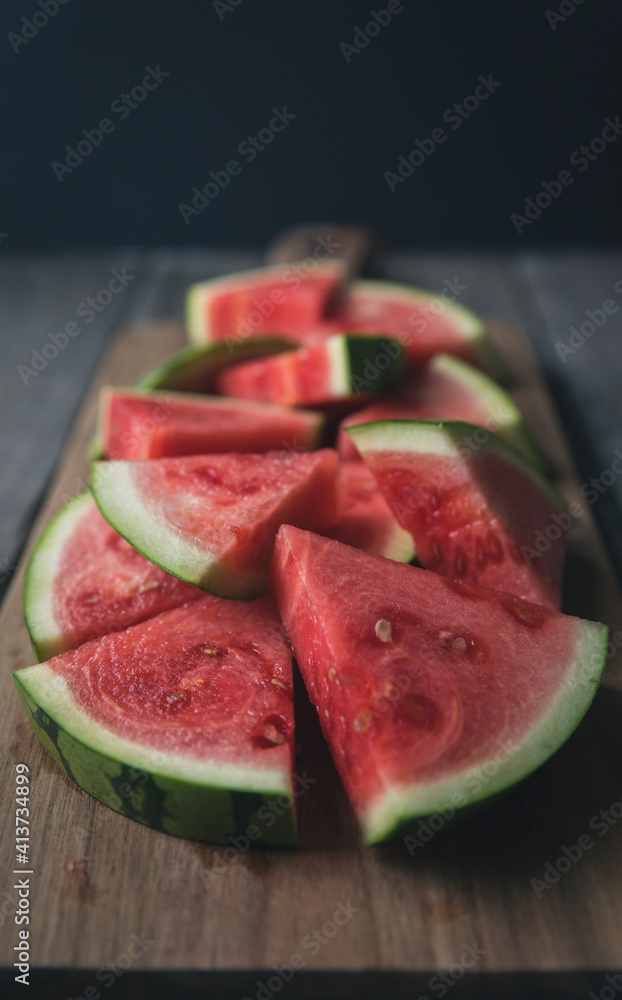 Close-up of watermelon slices on cutting board Close-up of watermelon slices on cutting board