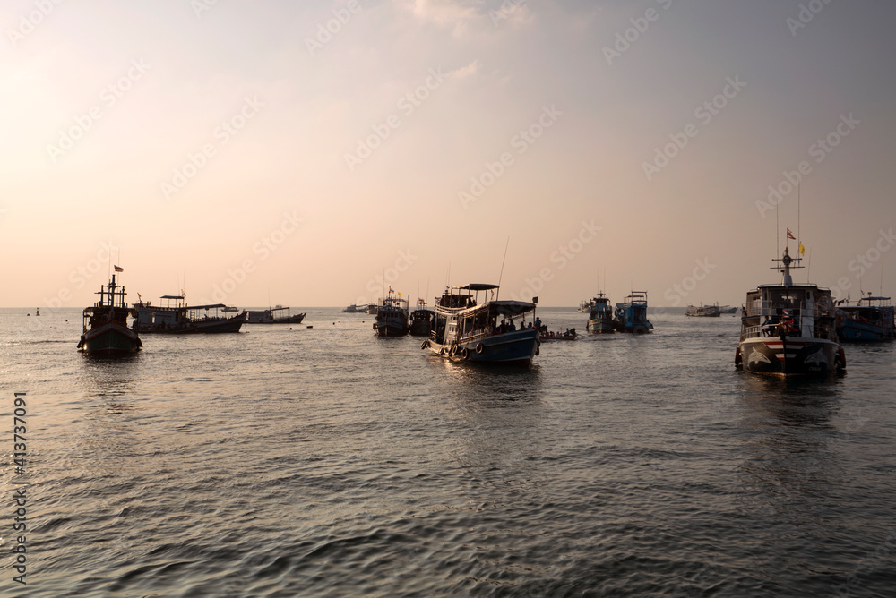 Boats in sea against clear sky