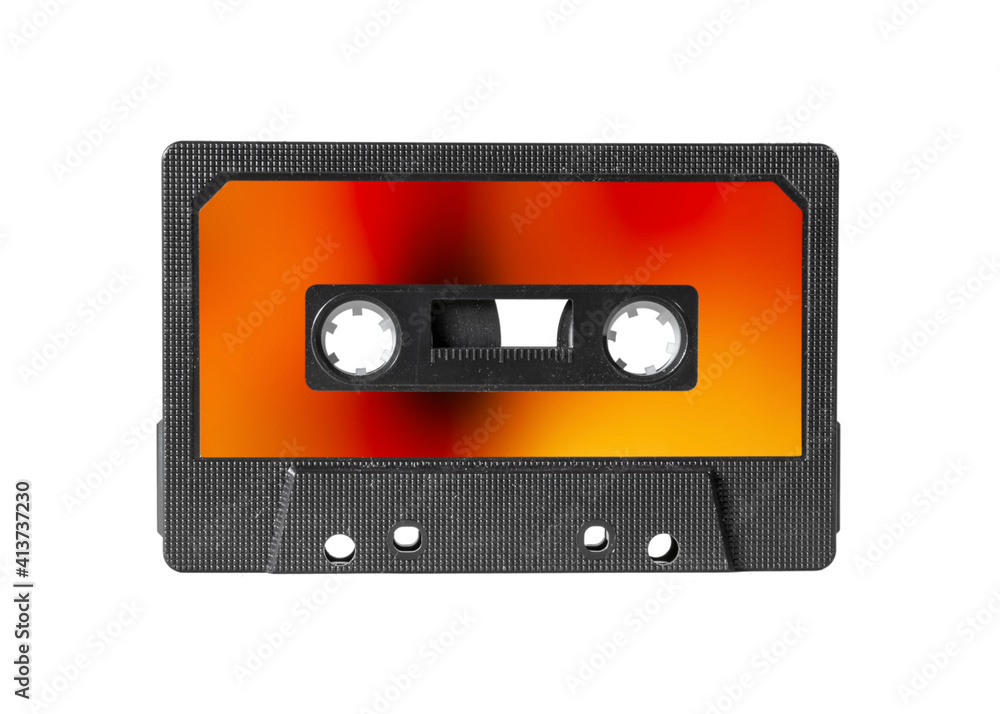 Fototapeta premium An old vintage cassette tape from the 1980s (obsolete music technology), with blurred fire flames as a label. 