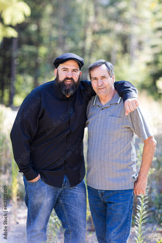 Portrait of smiling friends standing in forest Portrait of smiling friends standing in forest