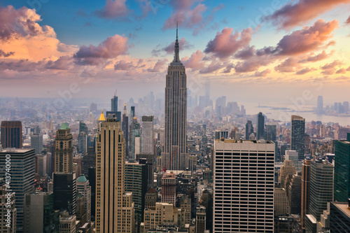 New York city empire state building landscape panorama at sunset with foggy clouds © adrian_ilie825