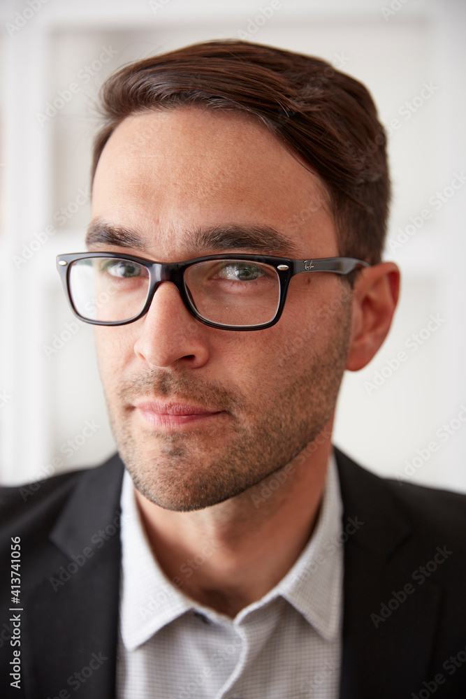 Close-up portrait of confident businessman at home Close-up portrait of confident businessman at home