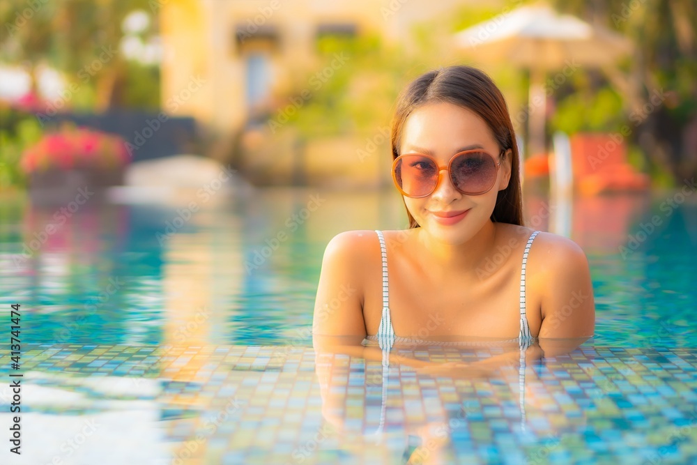 Portrait beautiful young asian woman relax smile enjoy leisure around swimming pool Portrait beautiful young asian woman relax smile enjoy leisure around swimming pool