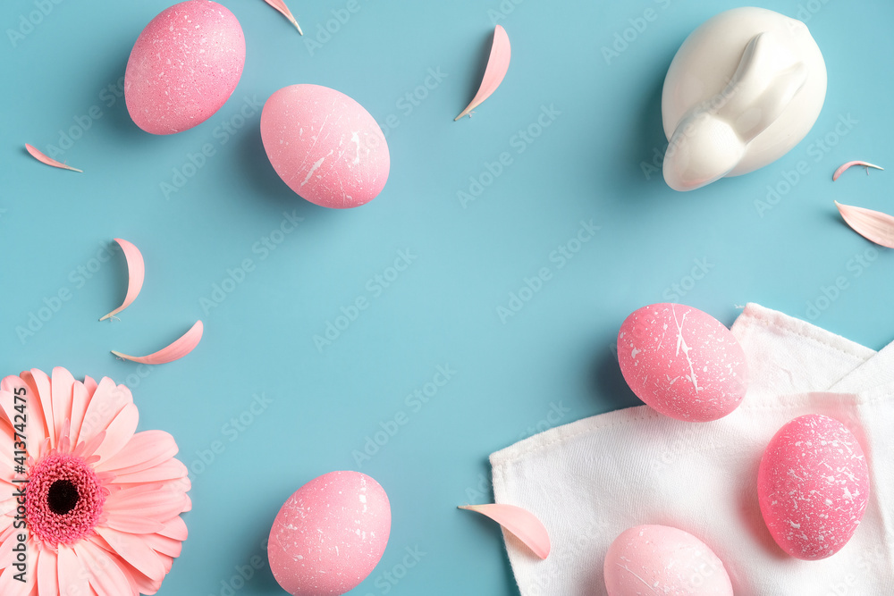 Pink Easter eggs, spring flowers, bunny rabbit on turquoise background. Flat lay, top view, trendy colors. Happy Easter concept. Pink Easter eggs, spring flowers, bunny rabbit on turquoise background. Flat lay, top view, trendy colors. Happy Easter concept.