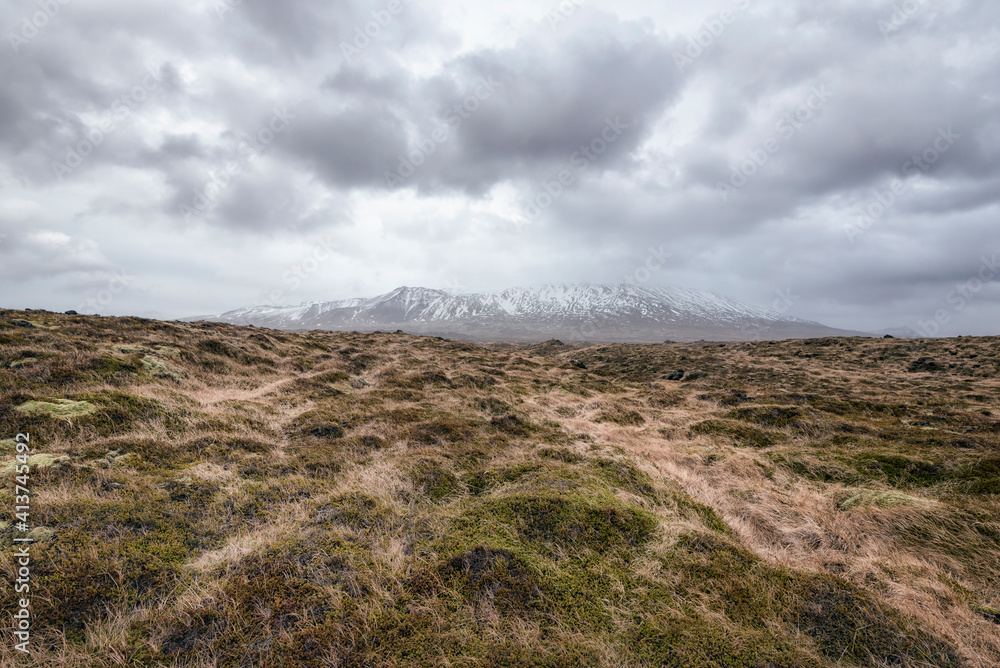 Scenic view of landscape against cloudy sky Scenic view of landscape against cloudy sky