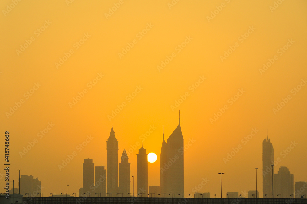 Silhouette skyscrapers against sky during sunset in city Silhouette skyscrapers against sky during sunset in city