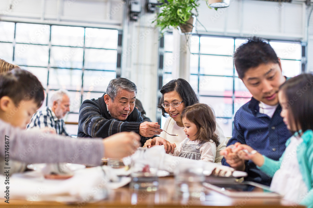 Family enjoying birthday in restaurant Family enjoying birthday in restaurant