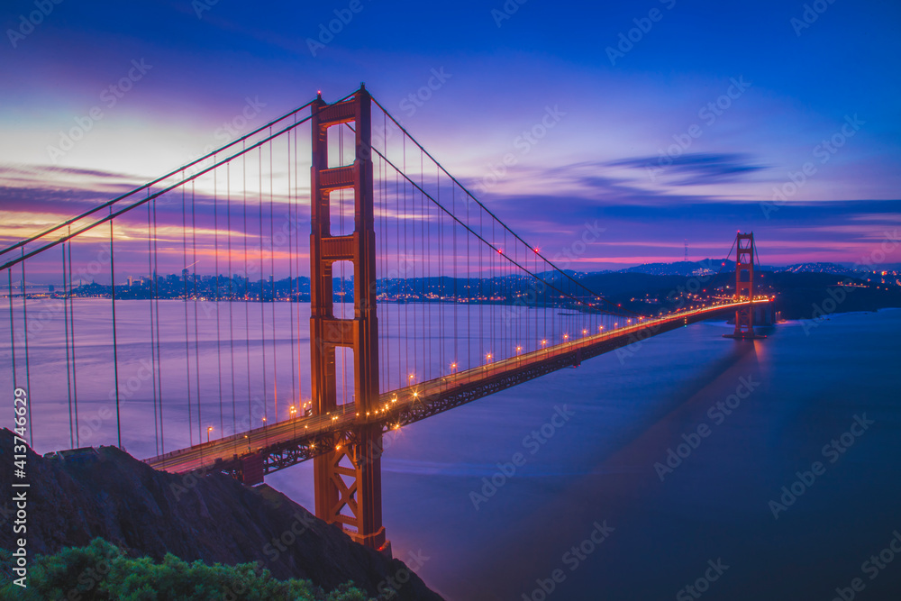Light trails on Golden Gate Bridge against blue sky at dusk Light trails on Golden Gate Bridge against blue sky at dusk