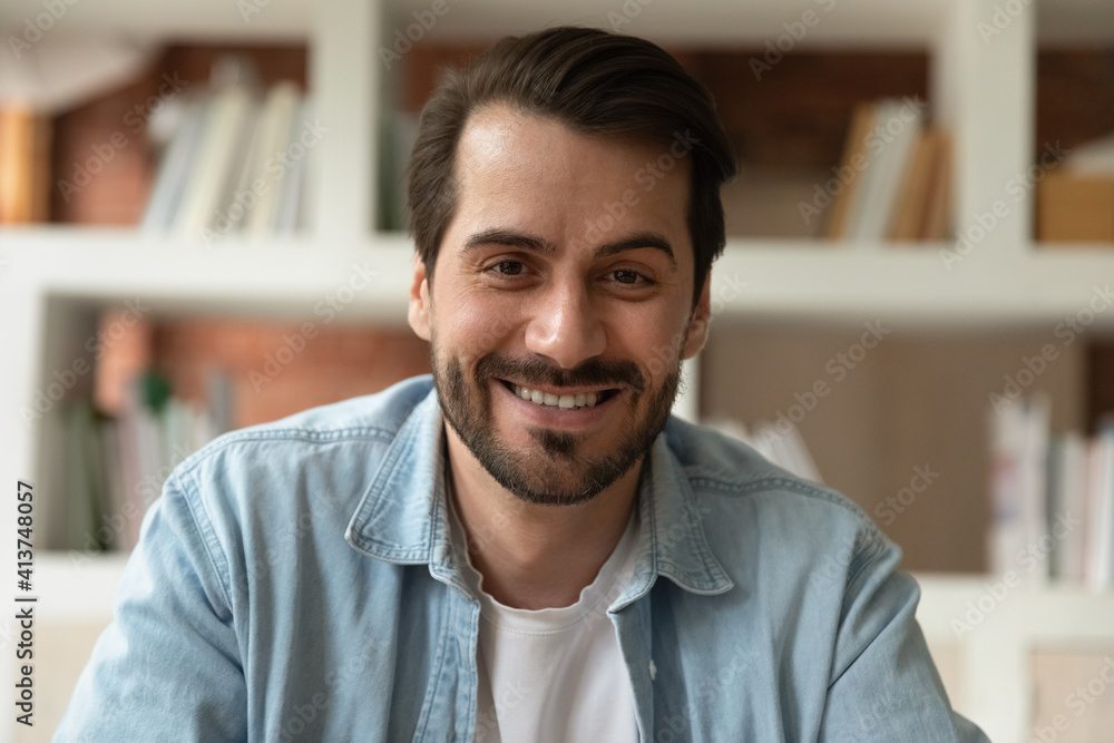 Close up headshot portrait of smiling young Caucasian man talk speak on video call. Profile picture screen view of have webcam digital virtual conference or event online. Communication concept. Close up headshot portrait of smiling young Caucasian man talk speak on video call. Profile picture screen view of have webcam digital virtual conference or event online. Communication concept.