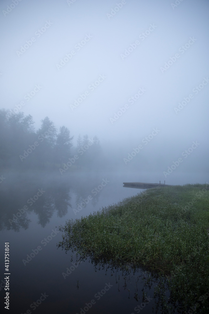Scenic view of lake by trees and sky during foggy weather Scenic view of lake by trees and sky during foggy weather
