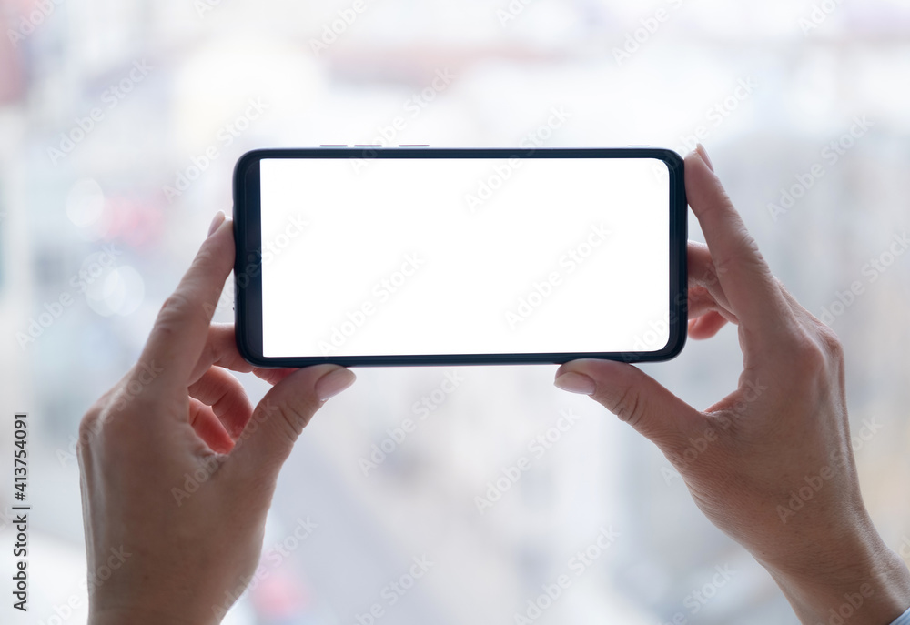 Smartphone with blank screen in woman hands Smartphone with blank screen in woman hands