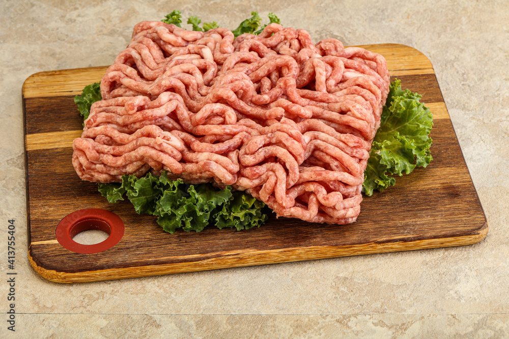 Raw pork minced meat over board Raw pork minced meat over board