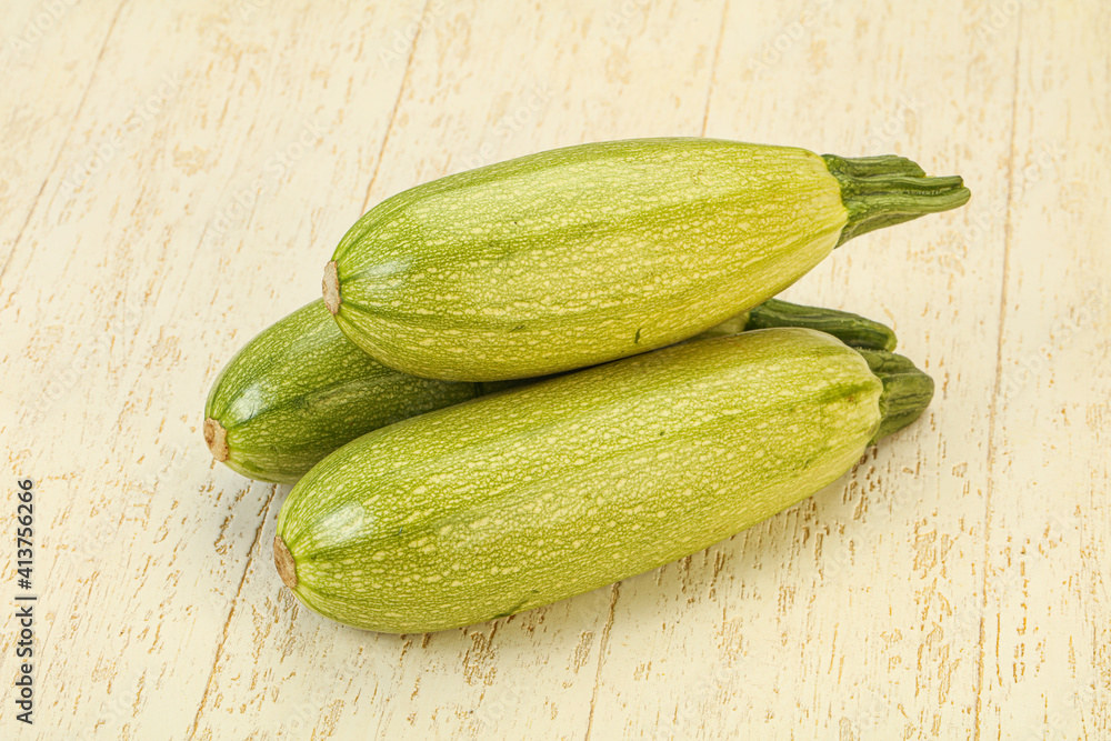 Young tasty zucchini over board Young tasty zucchini over board
