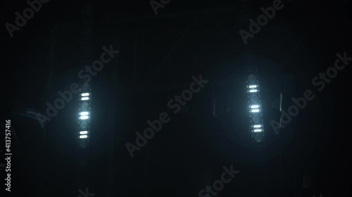 Stage with spot lighting, shining empty scene for holiday show, award ceremony or advertising. Neon lighting effects before the concert. Spotlights shine brightly, turn on and off. Close up. photo