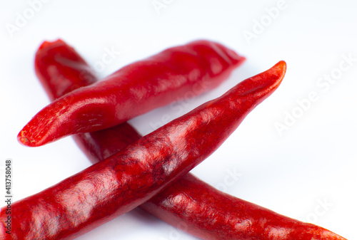 Red hot chili peppers on white background. Close up.