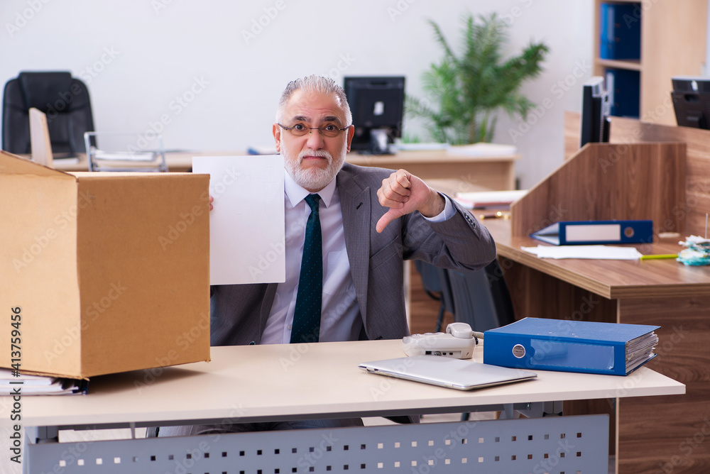 Old male employee being fired from his work Old male employee being fired from his work