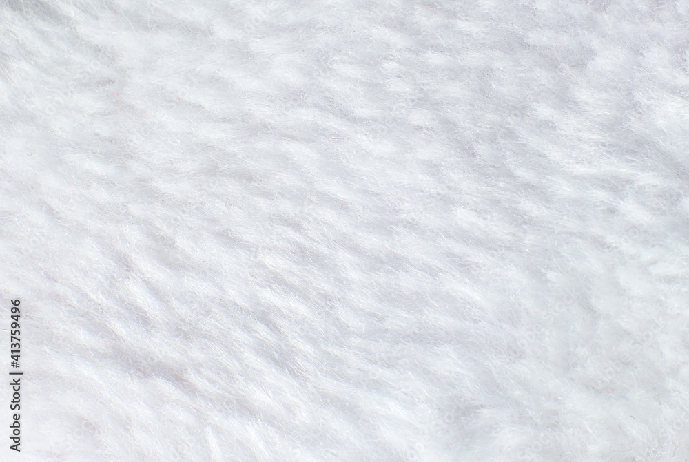 White cotton towel or carpet.fluffy texture background. Close up photo. White cotton towel or carpet.fluffy texture background. Close up photo.