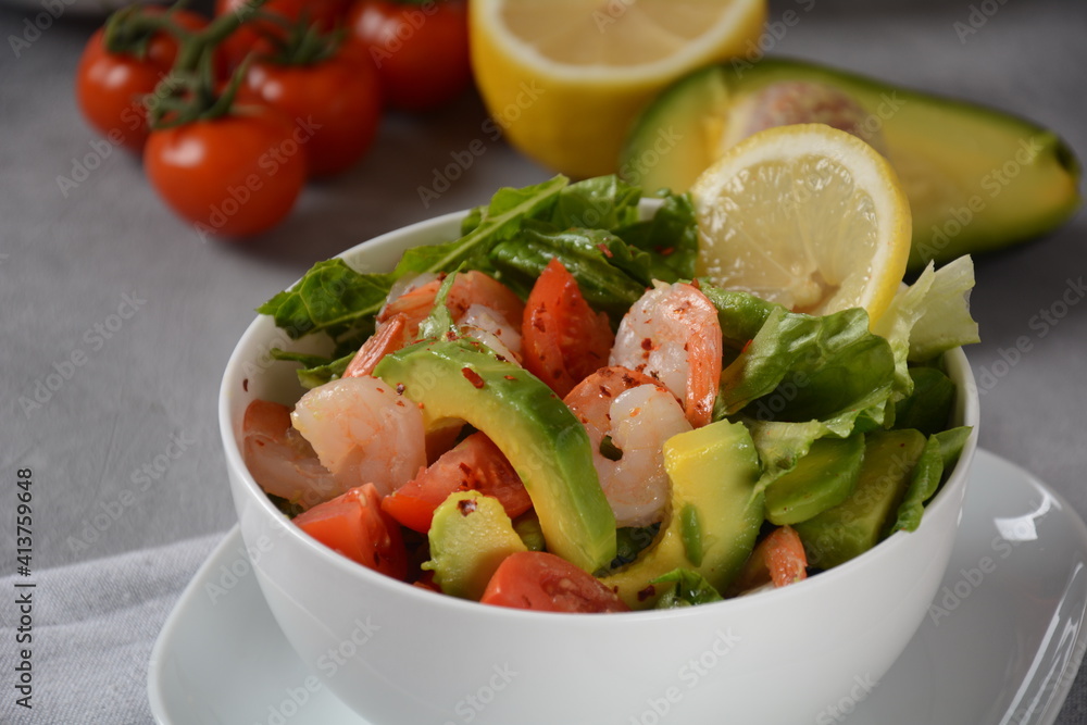 Avocado salad with shrimps and cherry tomatoes. Seafood breakfast