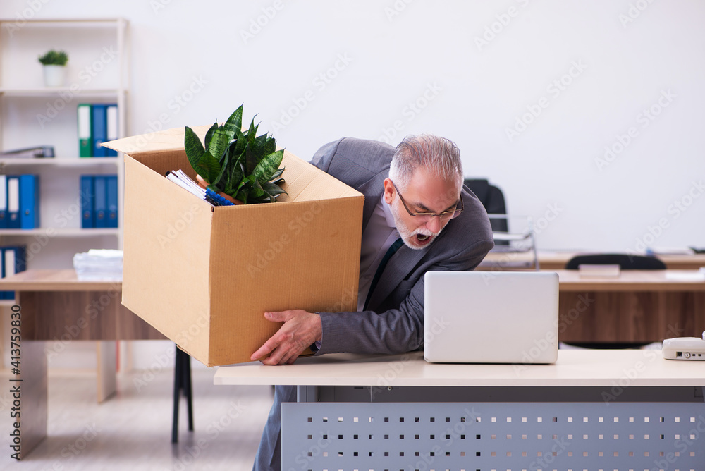 Old male employee being fired from his work Old male employee being fired from his work