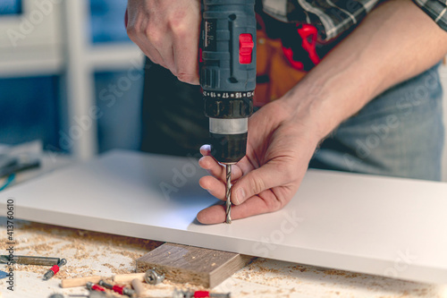 Wallpaper Mural Man working during process of furniture manufacturing Torontodigital.ca