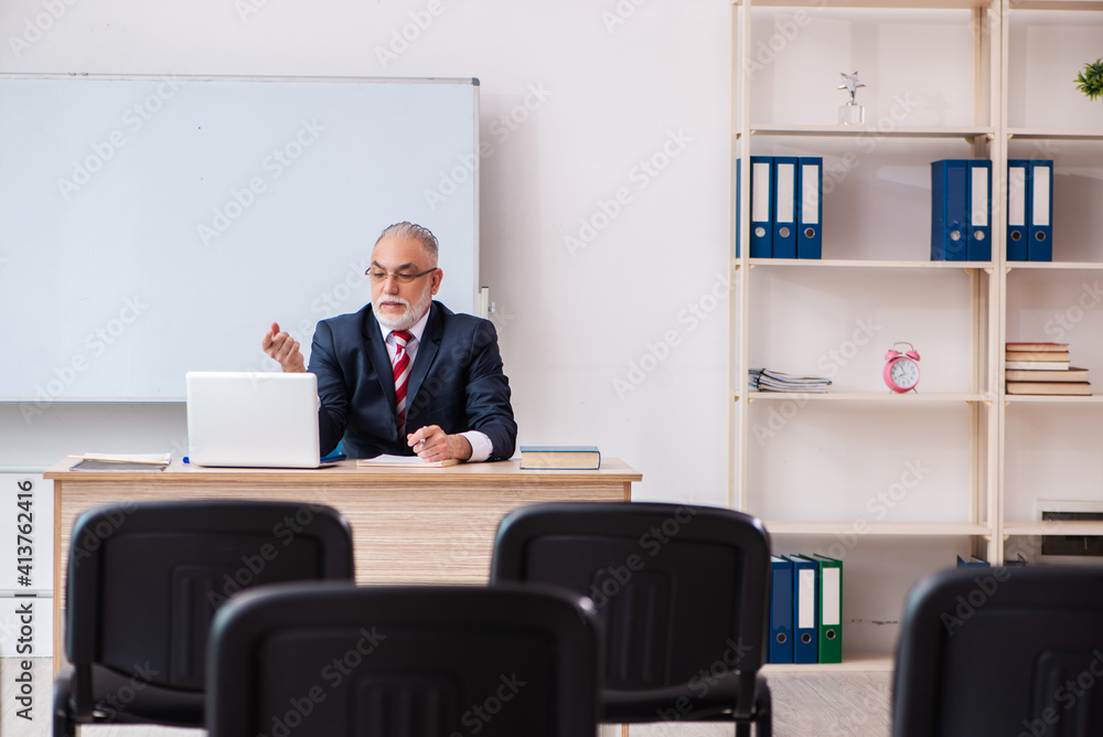 Old male business couch in the classroom during pandemic Old male business couch in the classroom during pandemic