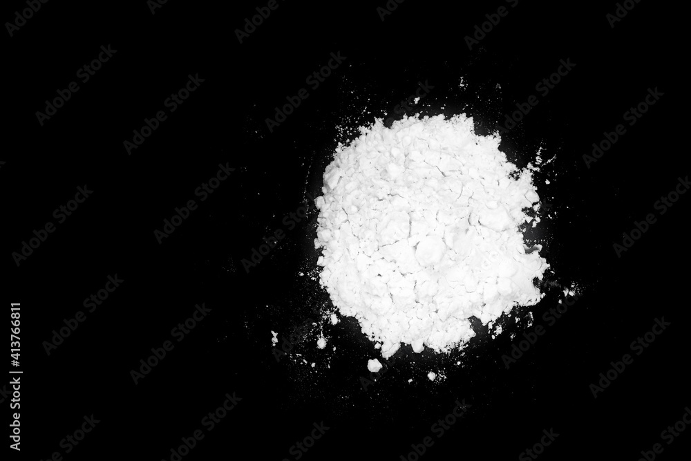 White powder isolated on black background White powder isolated on black background