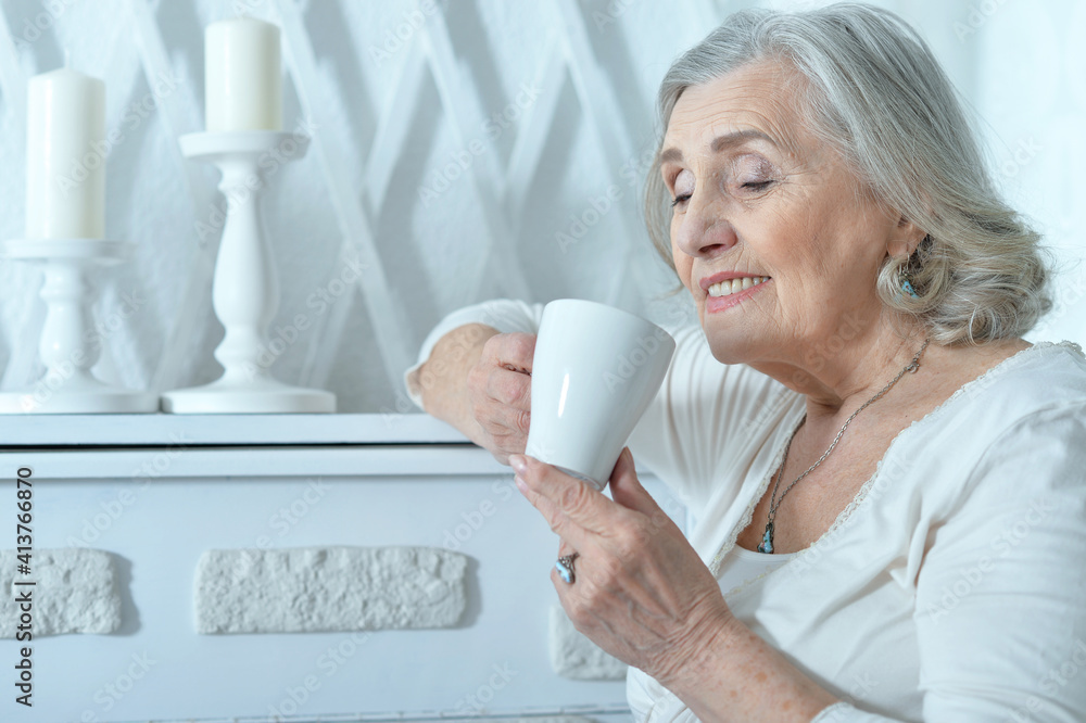 beautiful smiling senior woman drinking tea beautiful smiling senior woman drinking tea
