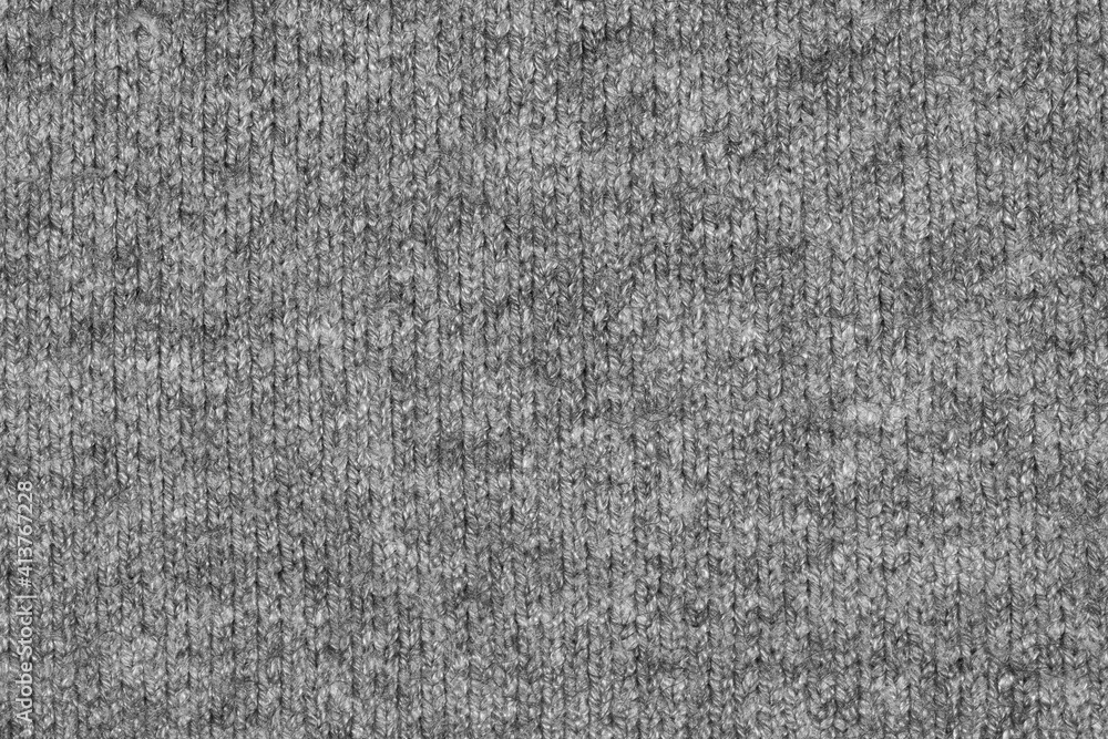 Gray natural texture of knitted wool textile material background. grey crochet cotton fabric woven canvas texture. close up Gray natural texture of knitted wool textile material background. grey crochet cotton fabric woven canvas texture. close up