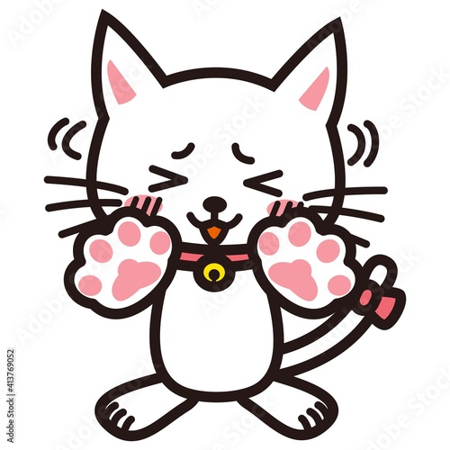 手を振って謙遜する白い猫