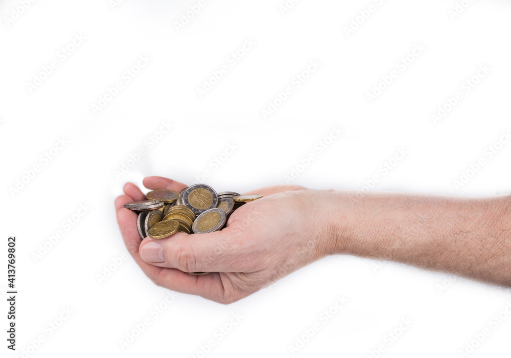 Male hand full of coins on a white background Male hand full of coins on a white background