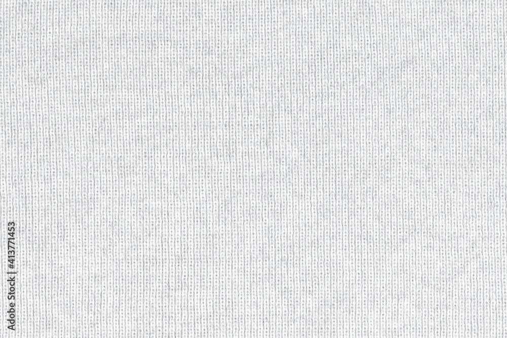 White natural texture of knitted wool textile material background. White crochet cotton fabric woven canvas texture. close up White natural texture of knitted wool textile material background. White crochet cotton fabric woven canvas texture. close up