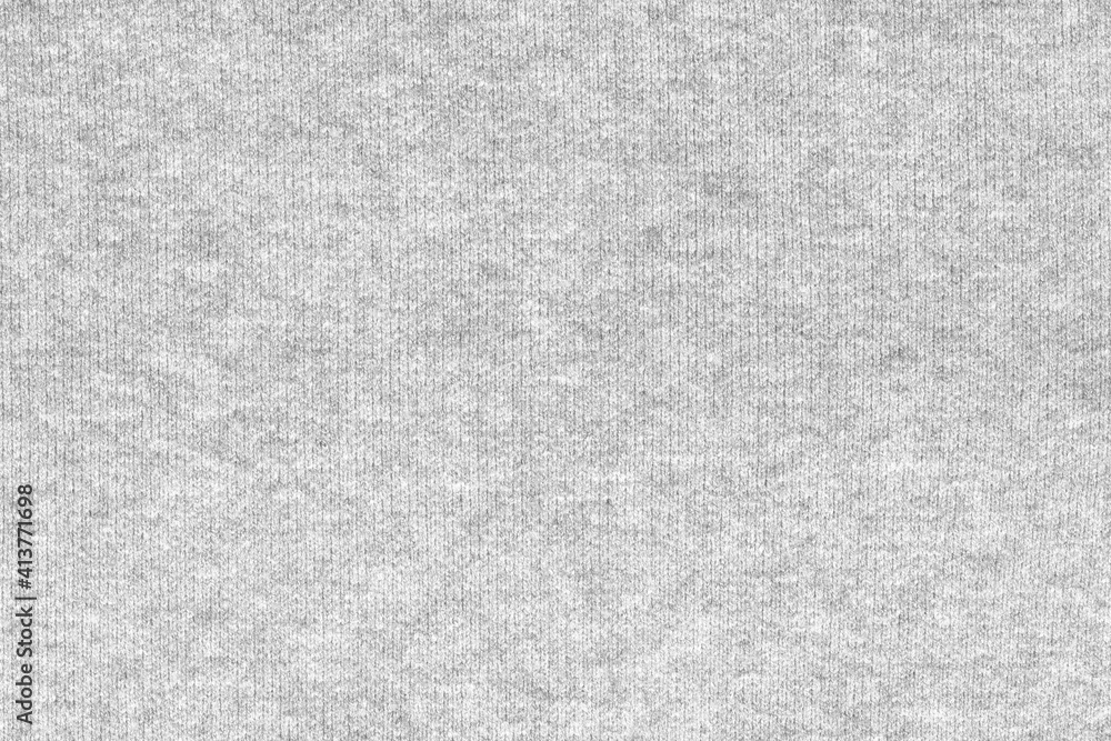 Fototapeta premium White natural texture of knitted wool textile material background. White crochet cotton fabric woven canvas texture. close up