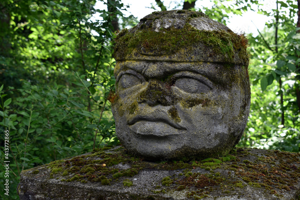 old stone head statue detail