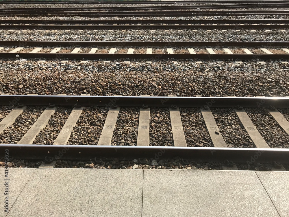 The image of waiting for a train while looking at the track