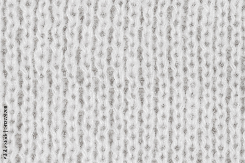 Naklejka premium White natural texture of knitted wool textile material background. White crochet cotton fabric woven canvas texture. close up