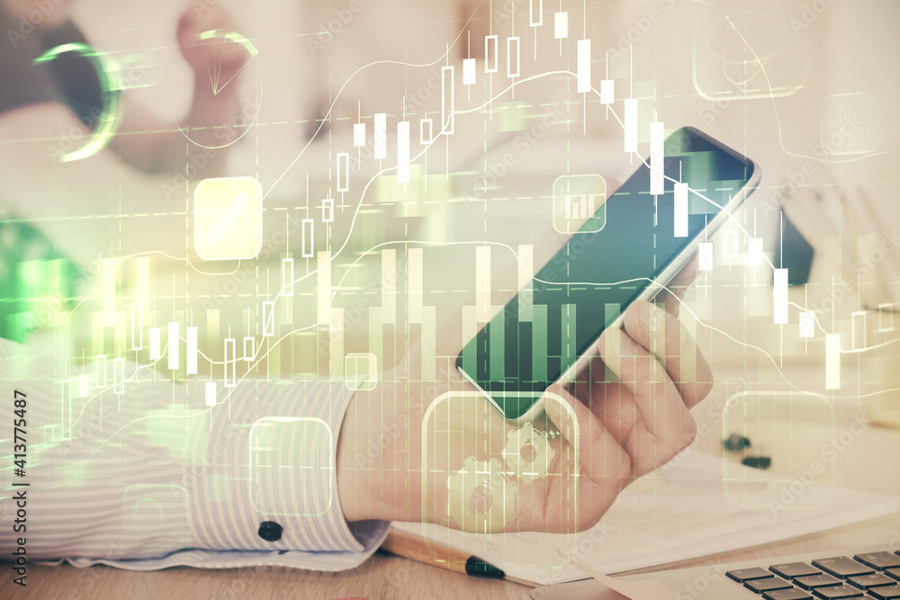 Fototapeta premium Double exposure of man's hands holding and using a digital device and forex graph drawing. Financial market concept.