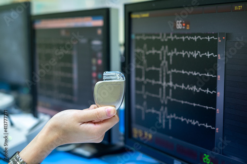 permanent pacemaker implantation device. This image demonstrates Permanent Pacemaker (PPM) on hands. photo