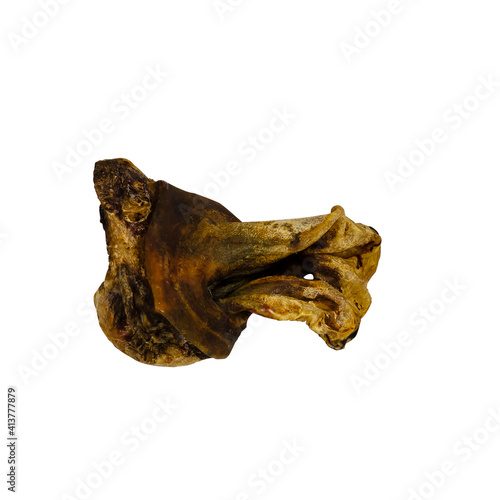 Pet treats. Dried ear cow on white background.