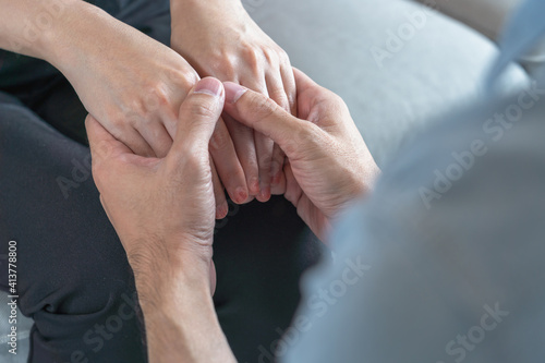 Asian couple holding hands