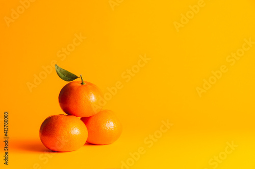 tangerines with orange background