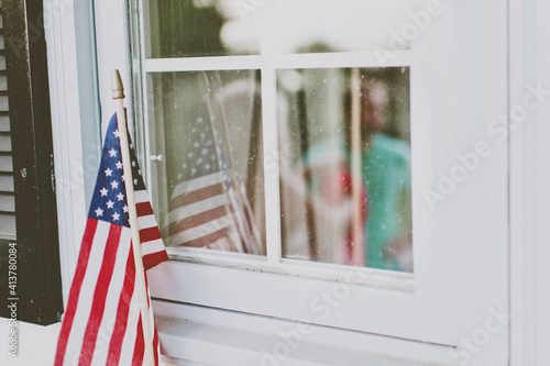 Close-up of American flag at window photo