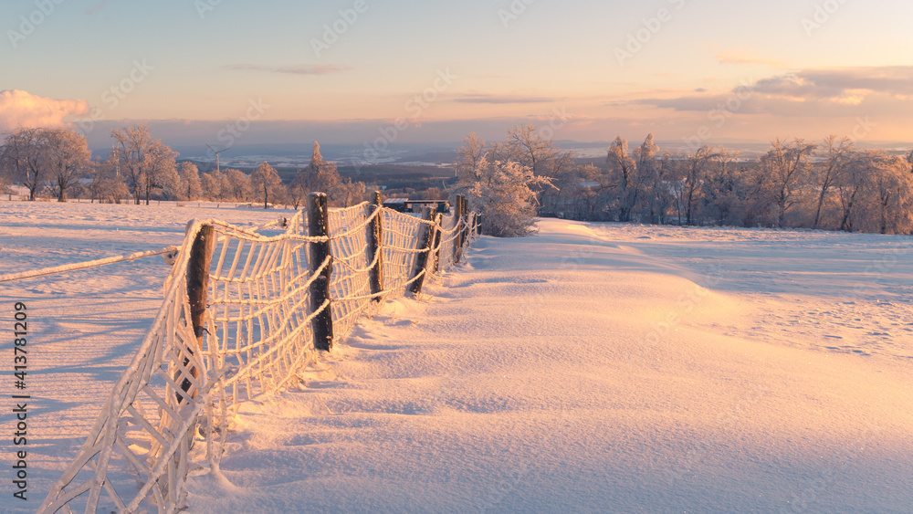 frozen fence in winter landscape frozen fence in winter landscape
