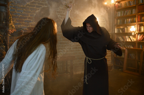Cuadro en lienzo Exorcist casting out satan from crazy woman