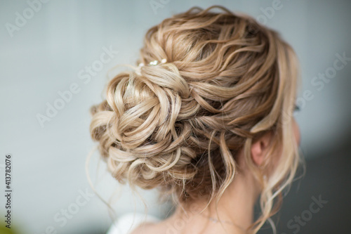 delicate hairstyle of the bride with decoration