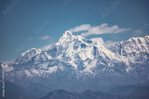 Himalayas  is a mountain range in South and East Asia separating the plains of the Indian subcontinent from the Tibetan Plateau. The range has many of Earth s highest peaks including the Mount Everest
