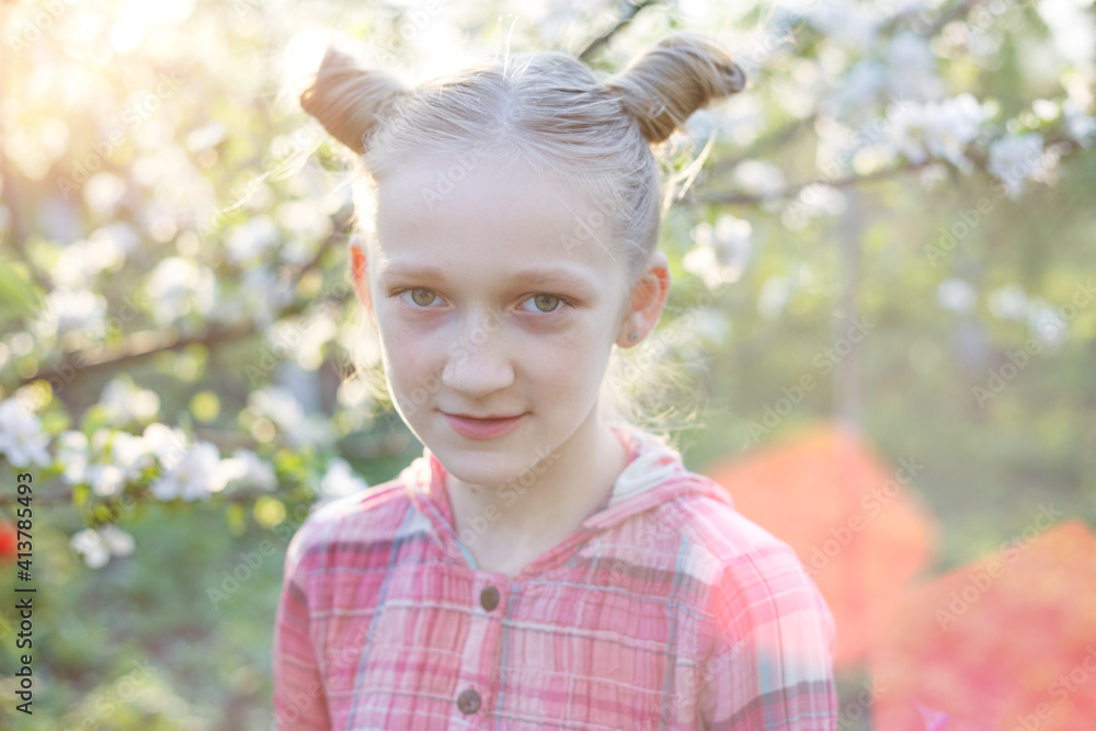 Beautiful little girl in the garden