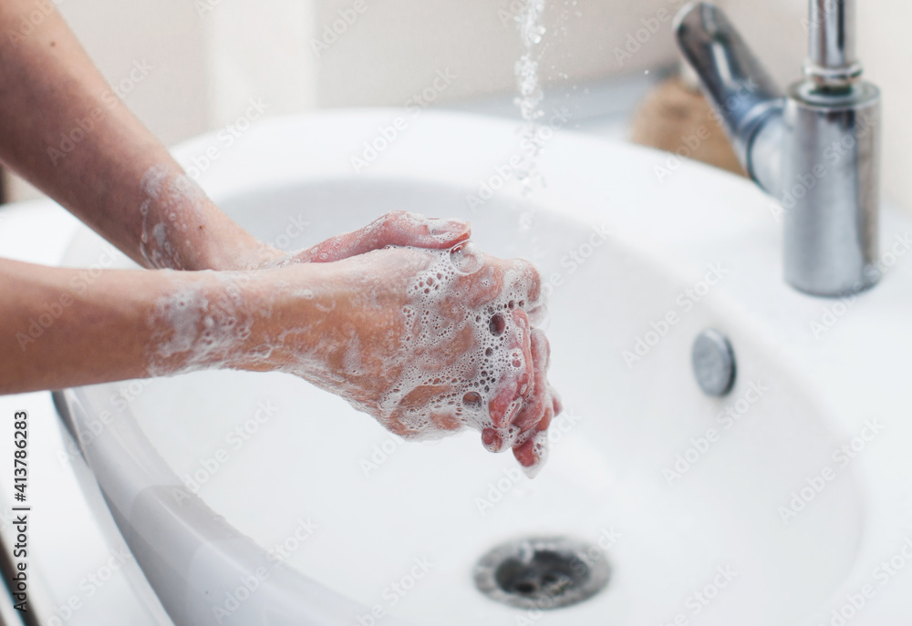 Washing hands rubbing with soap man Washing hands rubbing with soap man
